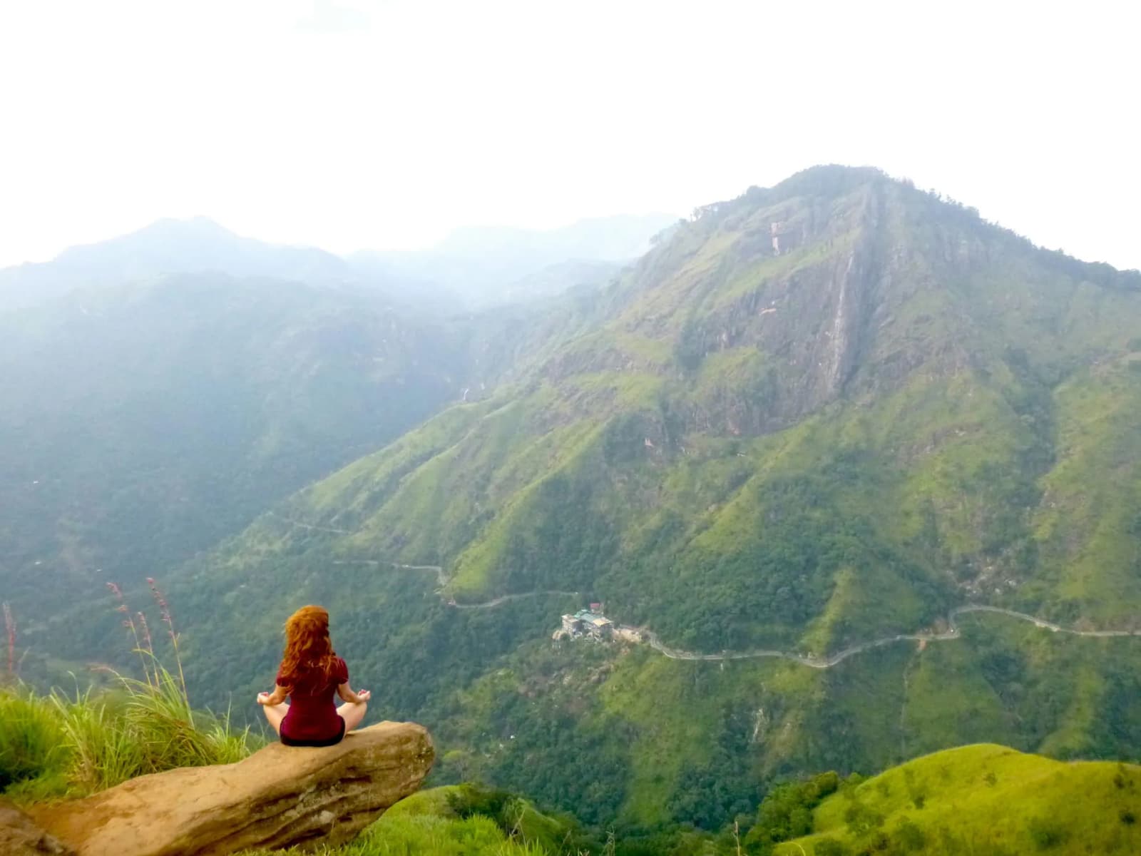 A quiet mountain road winding through the Sri Lankan highlands
